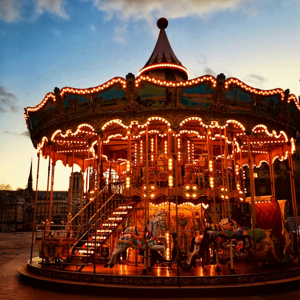 carousel with lights turned on during night time