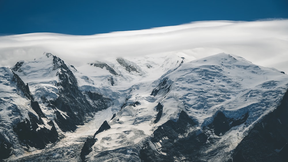 snow covered mountain under blue sky during daytime