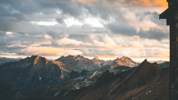 A breathtaking high-resolution view of Monterrey's mountains during sunset with vibrant colors illuminating the sky.