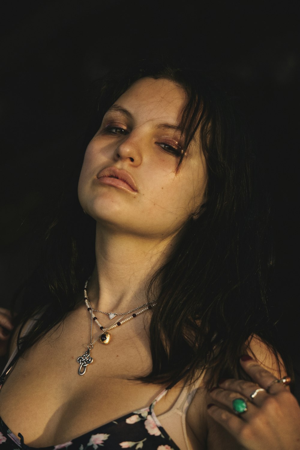 woman in silver necklace and black tank top