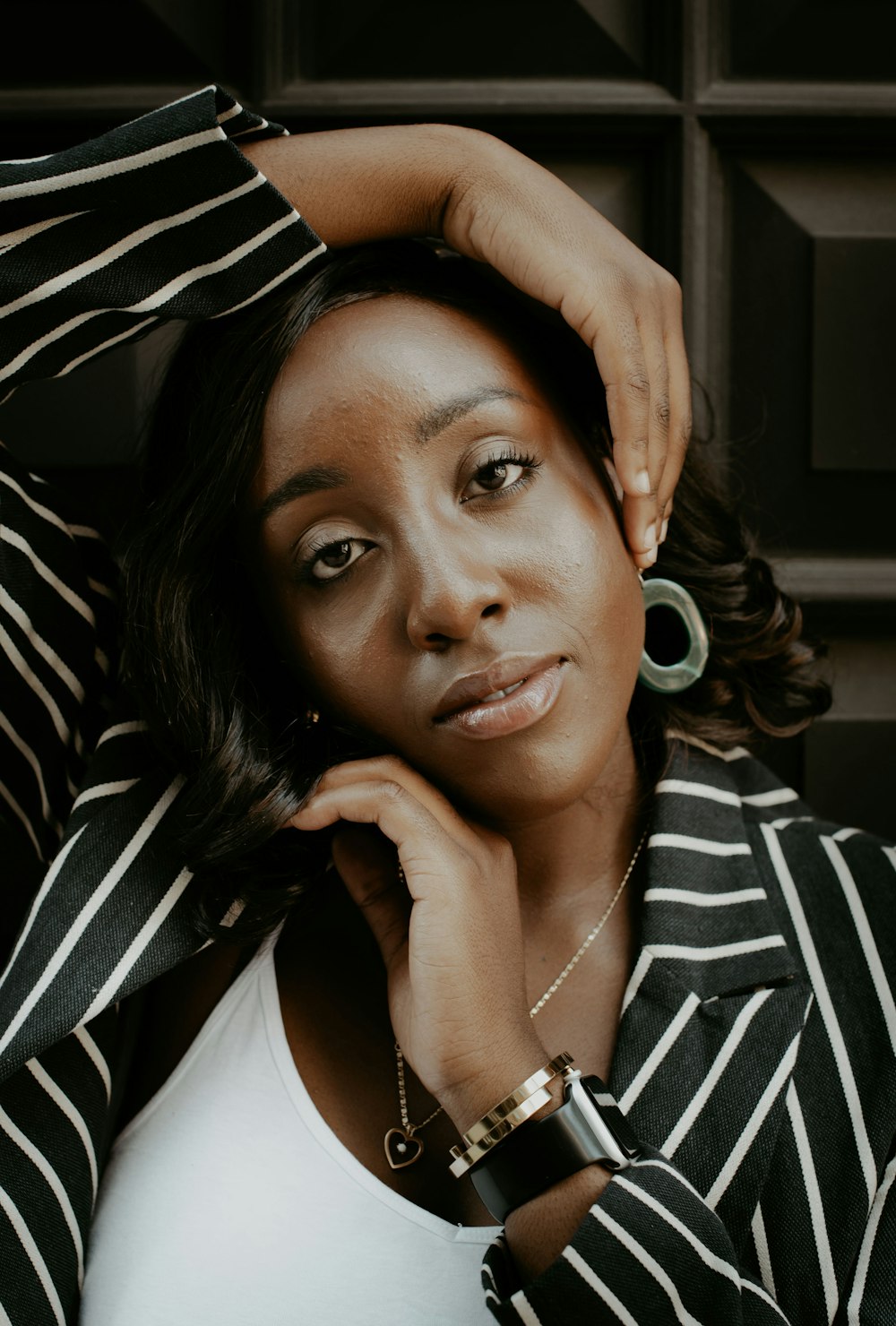 woman in black and white striped blazer