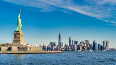 city skyline across body of water during daytime