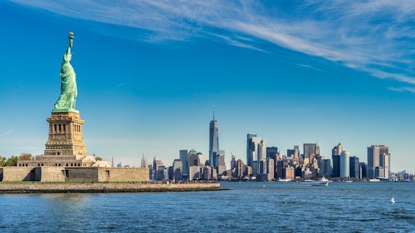 city skyline across body of water during daytime