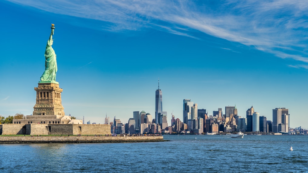 city skyline across body of water during daytime