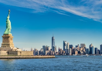 city skyline across body of water during daytime