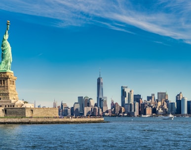 city skyline across body of water during daytime