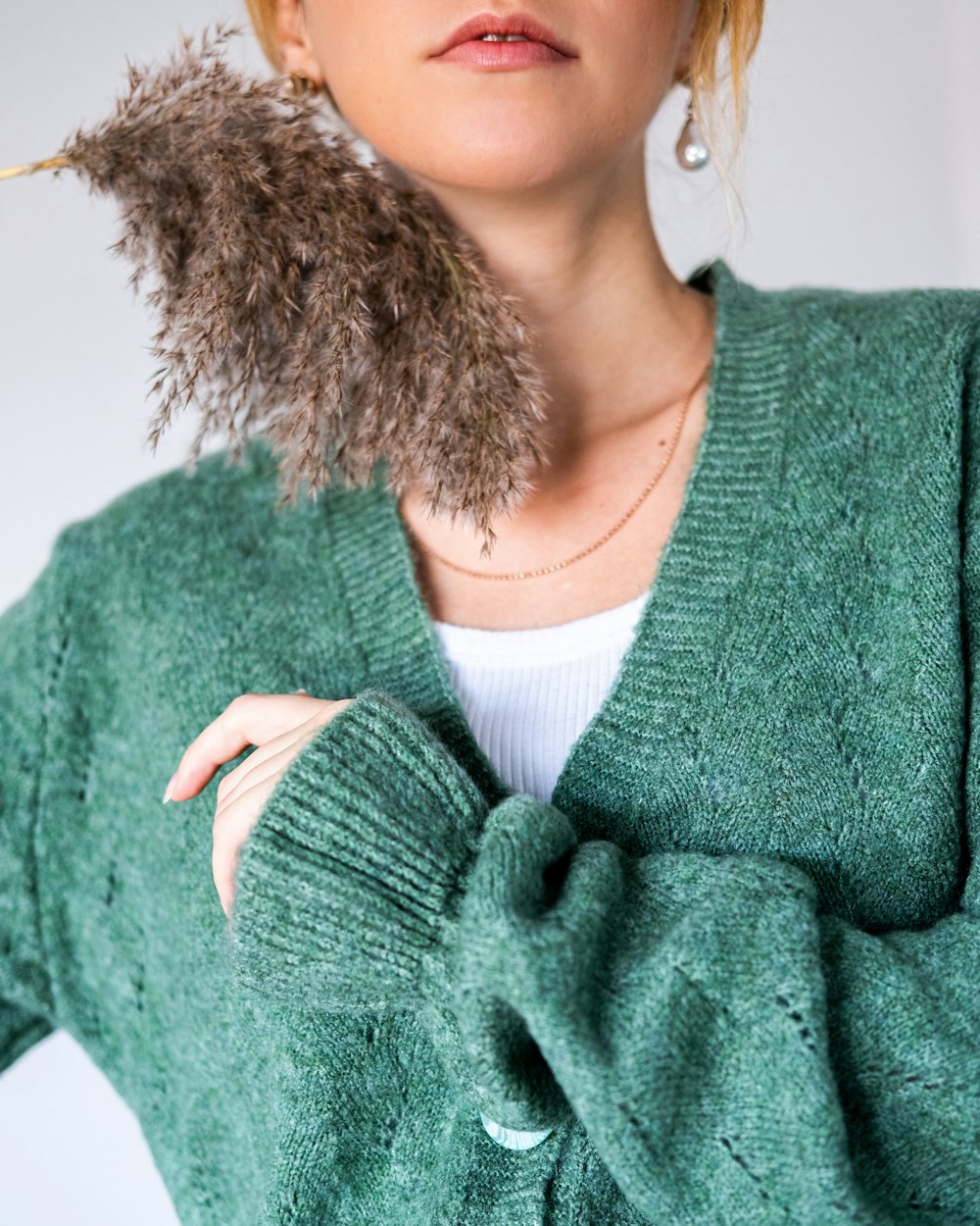 woman in green knit sweater