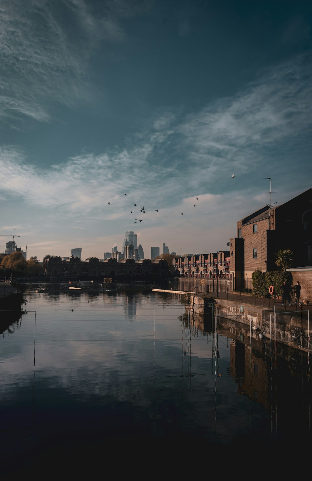 brown concrete building near body of water during daytime