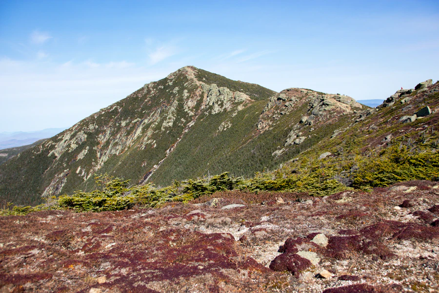 Fall foliage across a mountain ridge in New Hampshire's White Mountains, part of the state's North Country dating pool