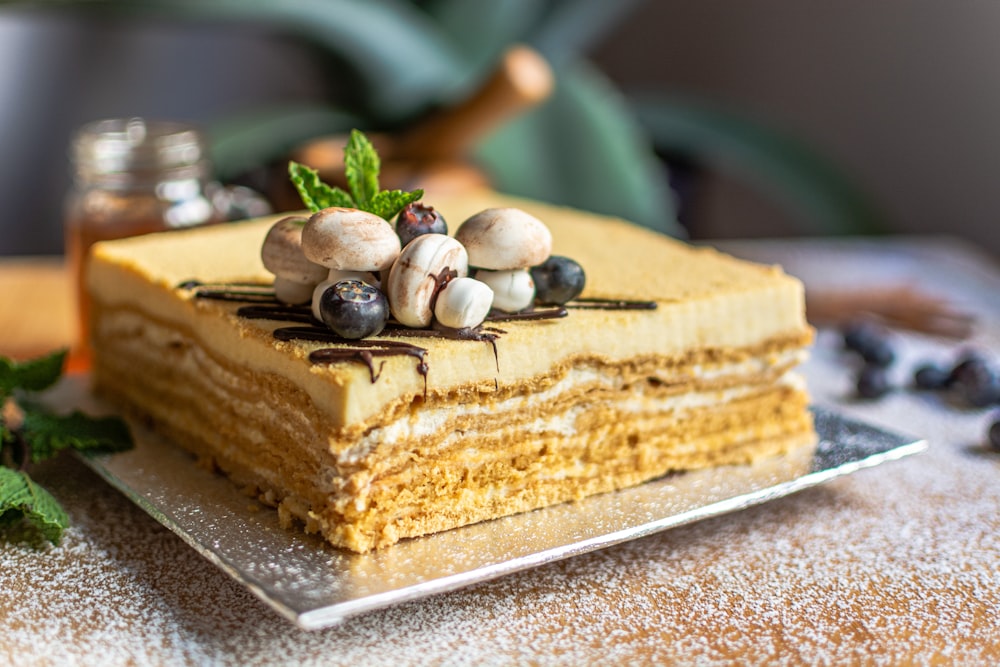 sliced cake with white icing on top