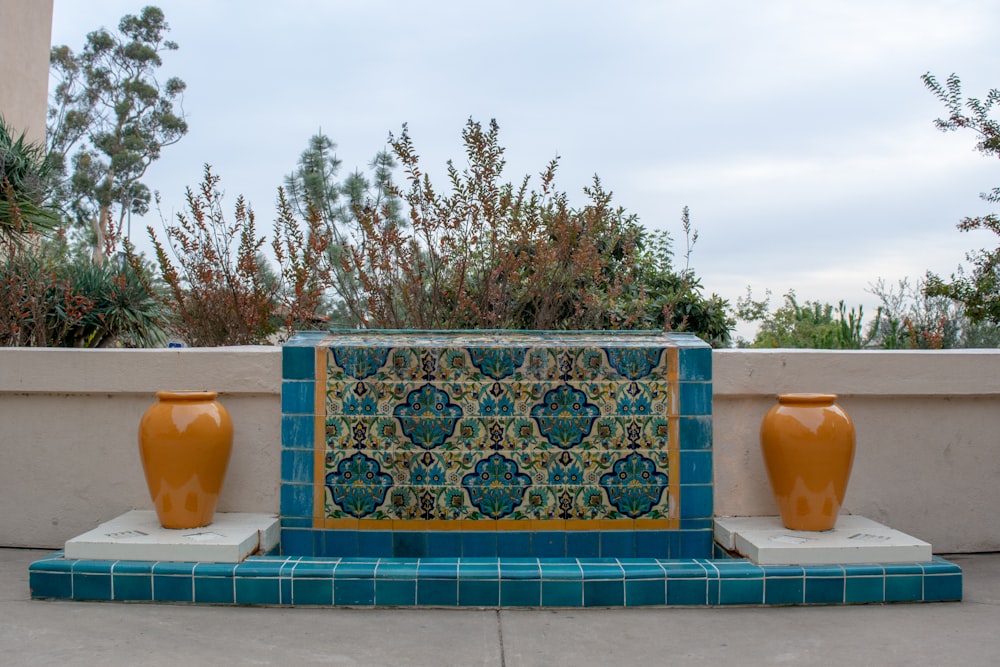 blue and white floral rug on swimming pool