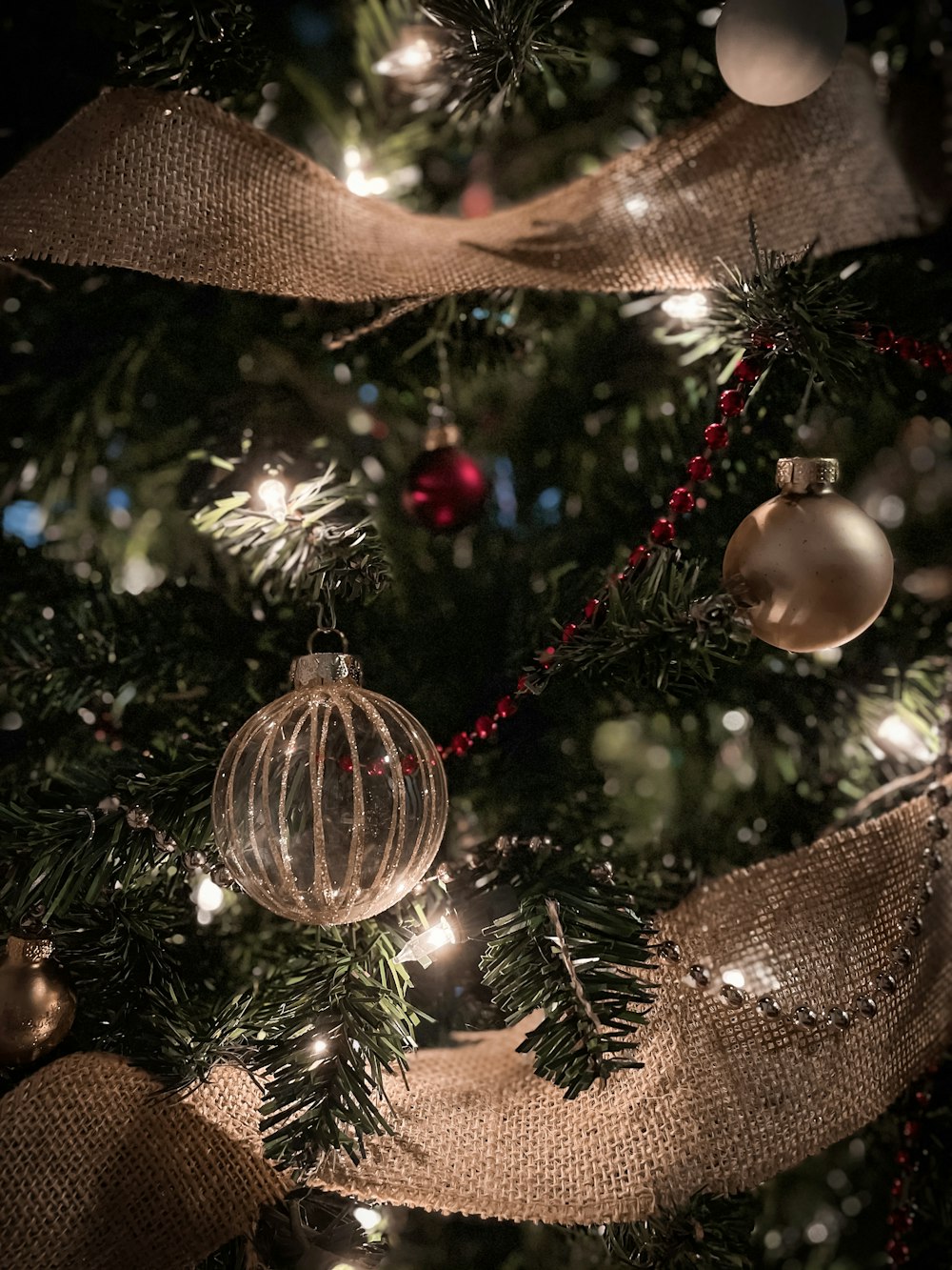 gold and red baubles on christmas tree