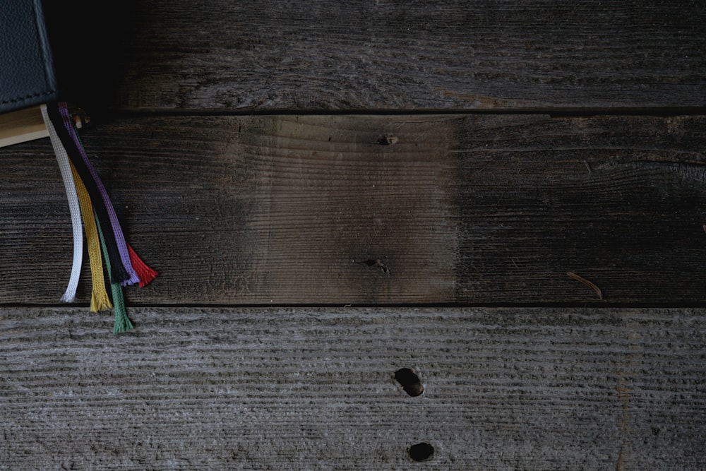 green and red umbrella on brown wooden table