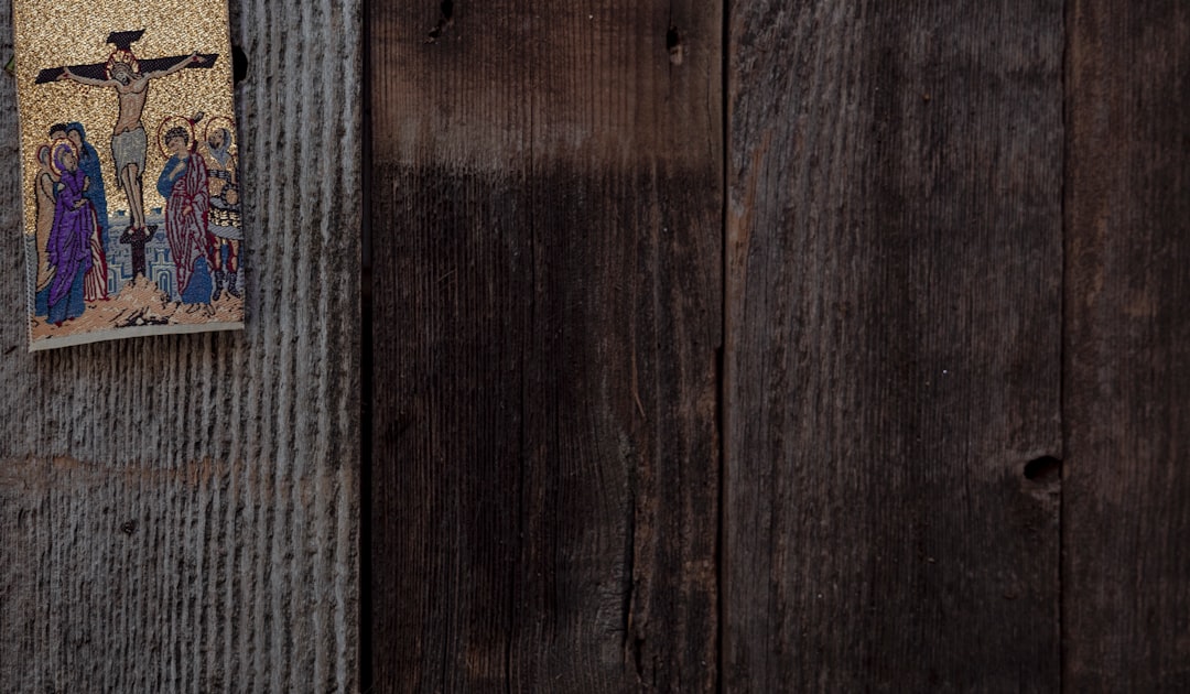 brown wooden door with gray textile
