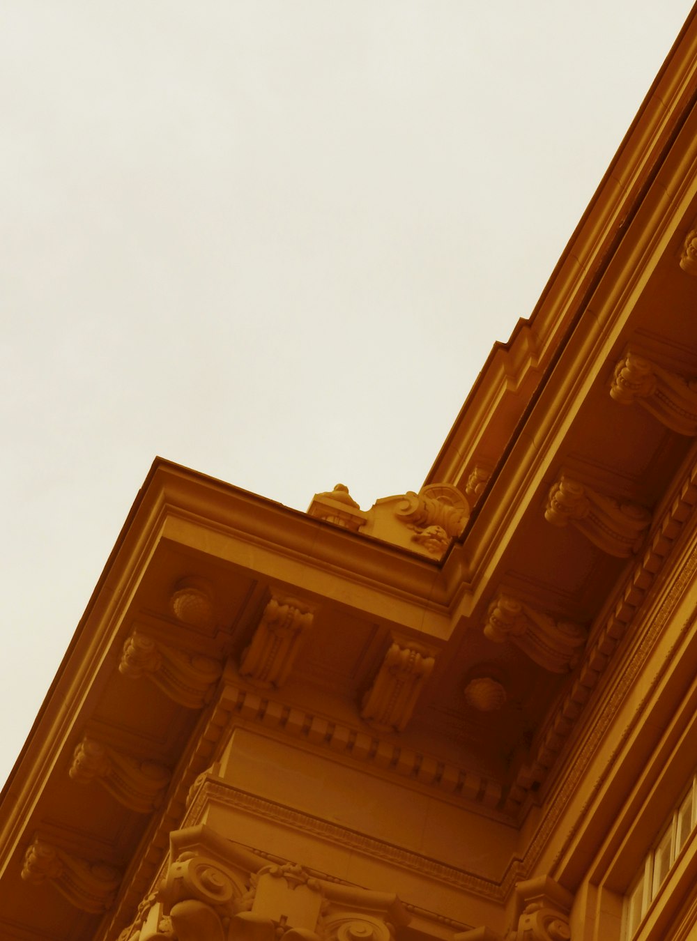 brown concrete building under white sky during daytime