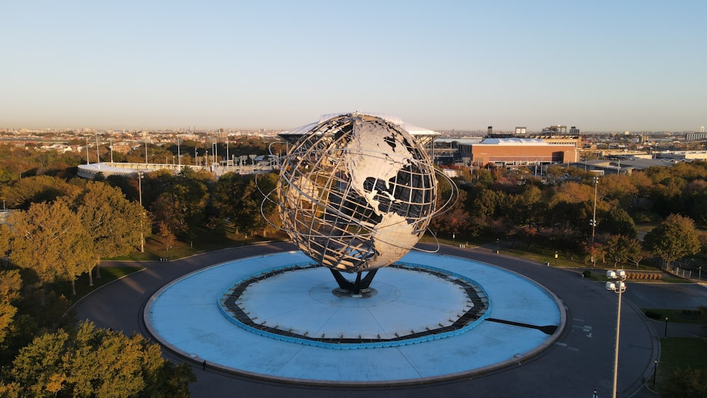white and black globe statue on top of a building