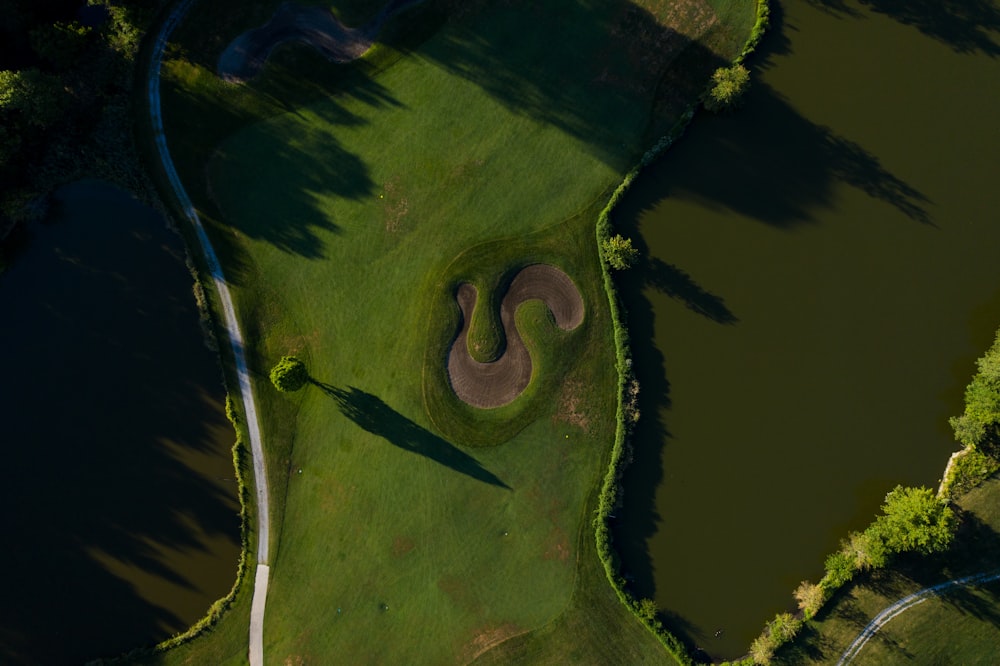 aerial view of green and brown lake