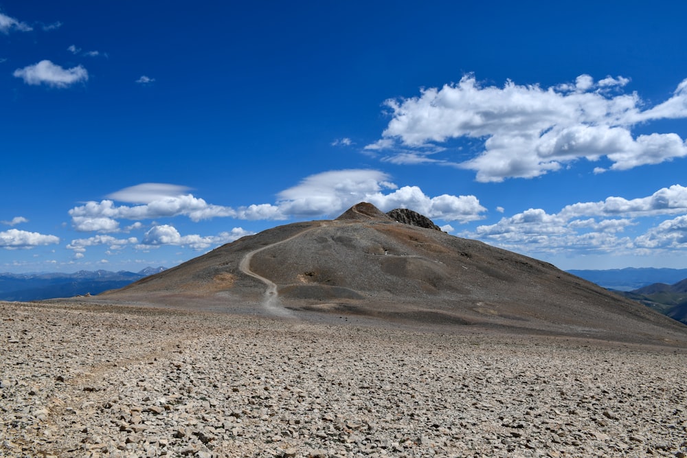 brown mountain under blue sky during daytime