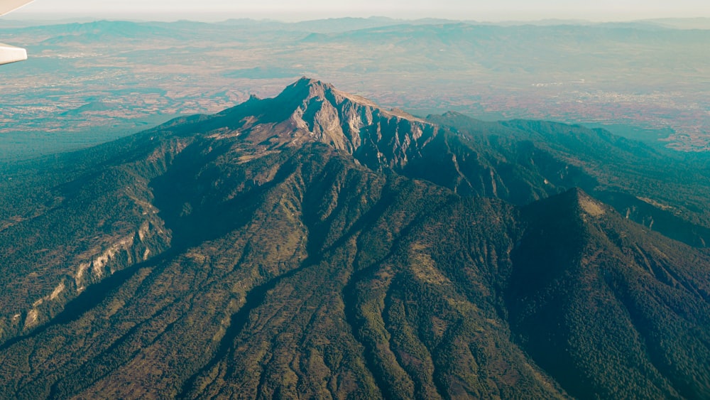aerial view of brown and green mountains during daytime