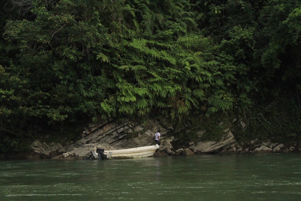 people riding on boat on river during daytime