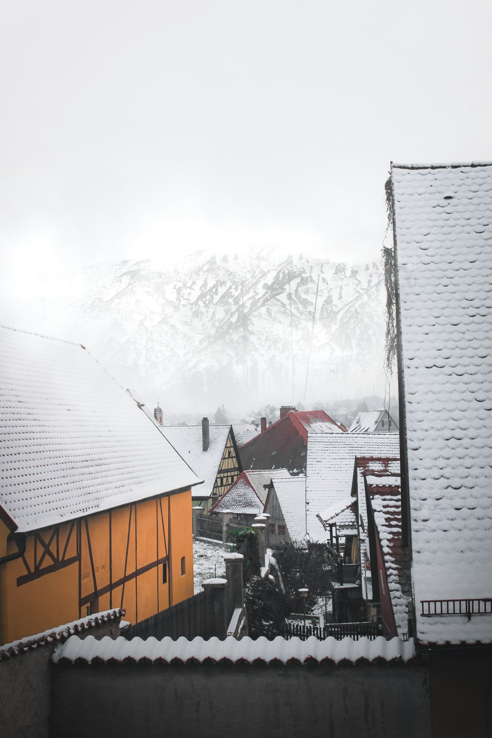 brown wooden house covered with snow