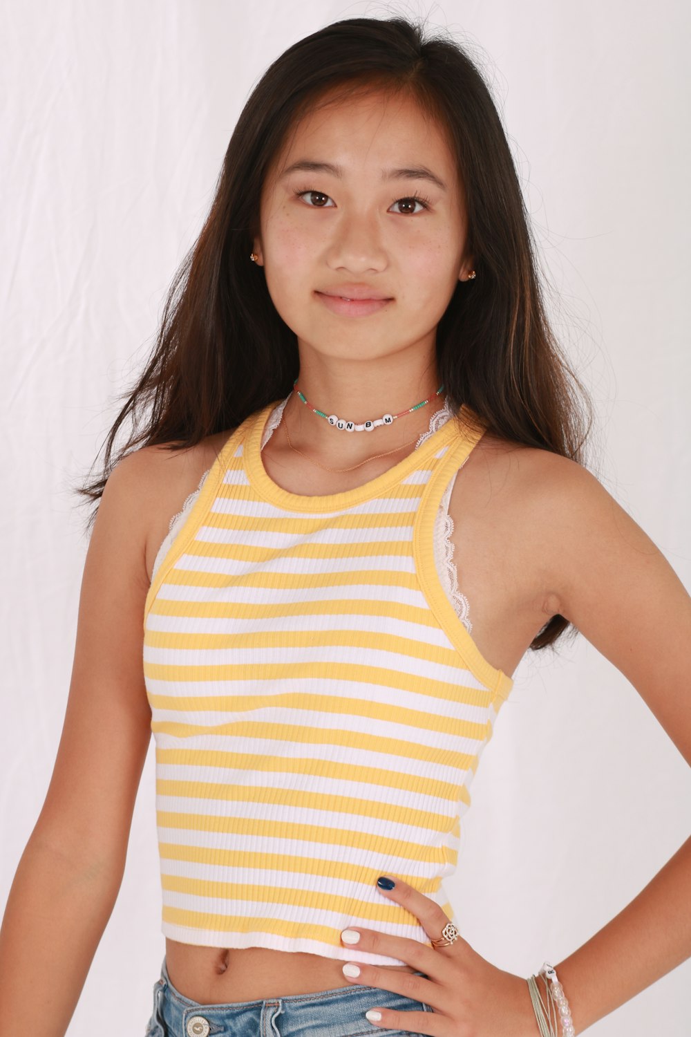 woman in yellow and white stripe tank top