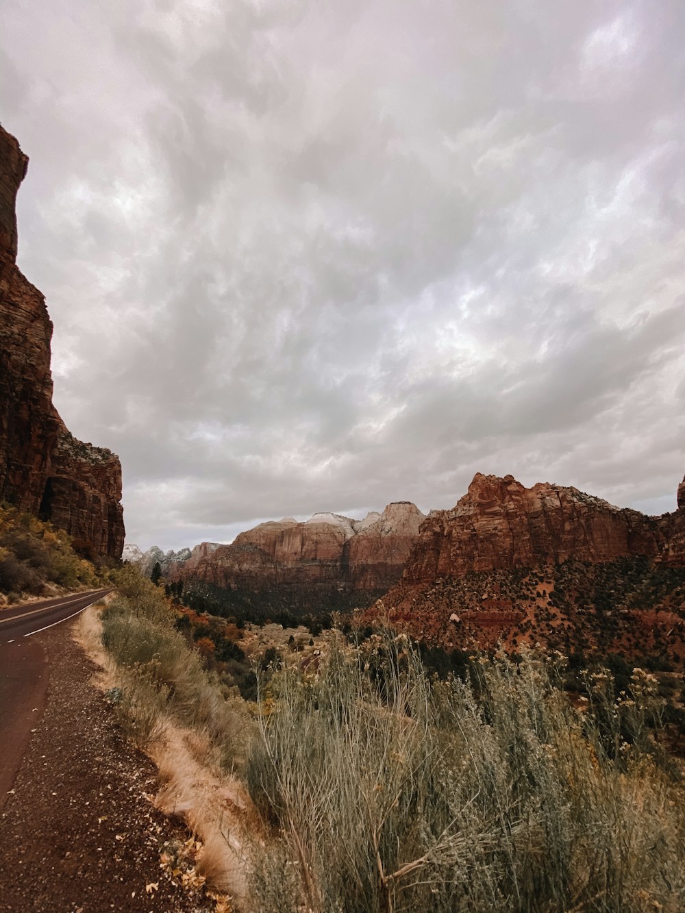 brown rocky mountain under cloudy sky during daytime