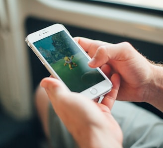 person holding white iphone 5