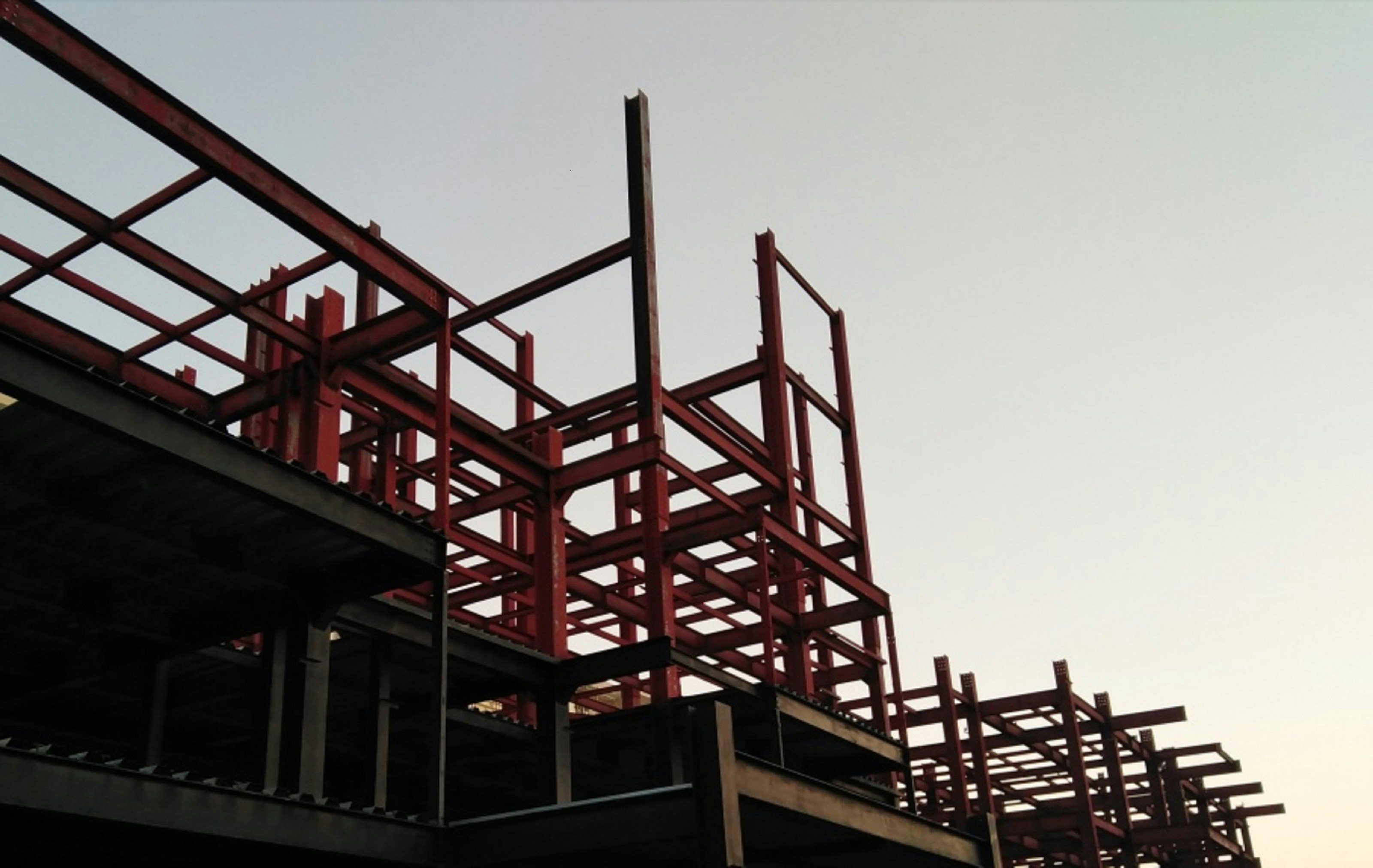 Red metal construction frame in daylight