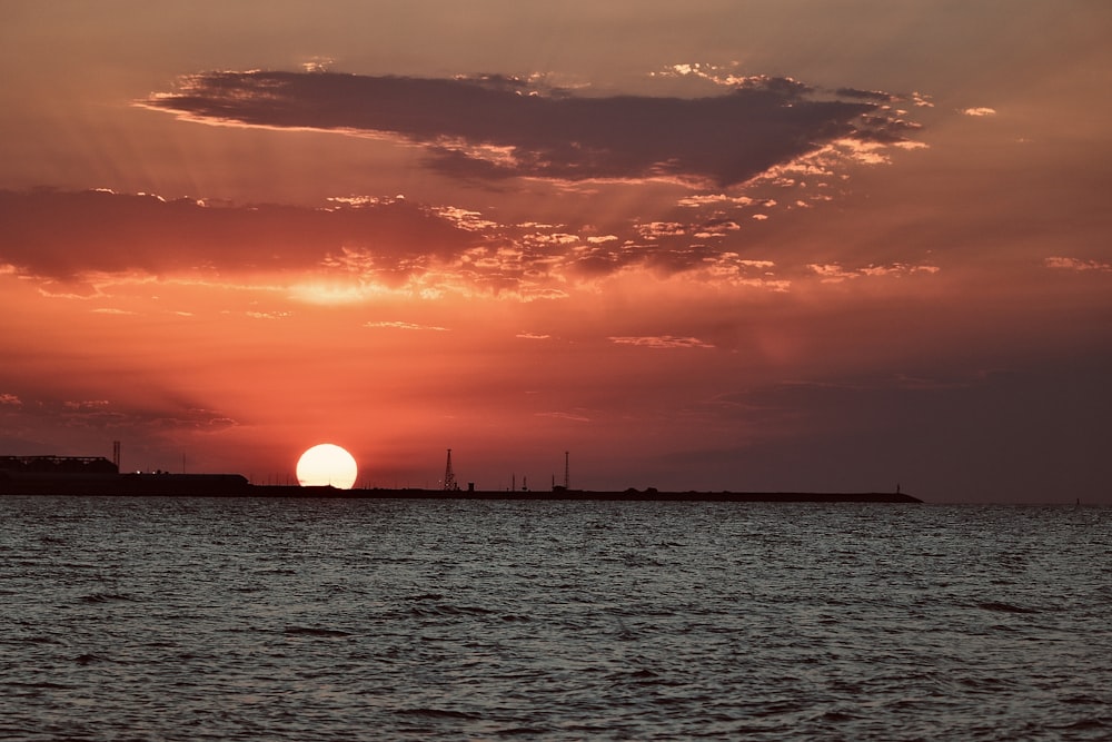 body of water during sunset