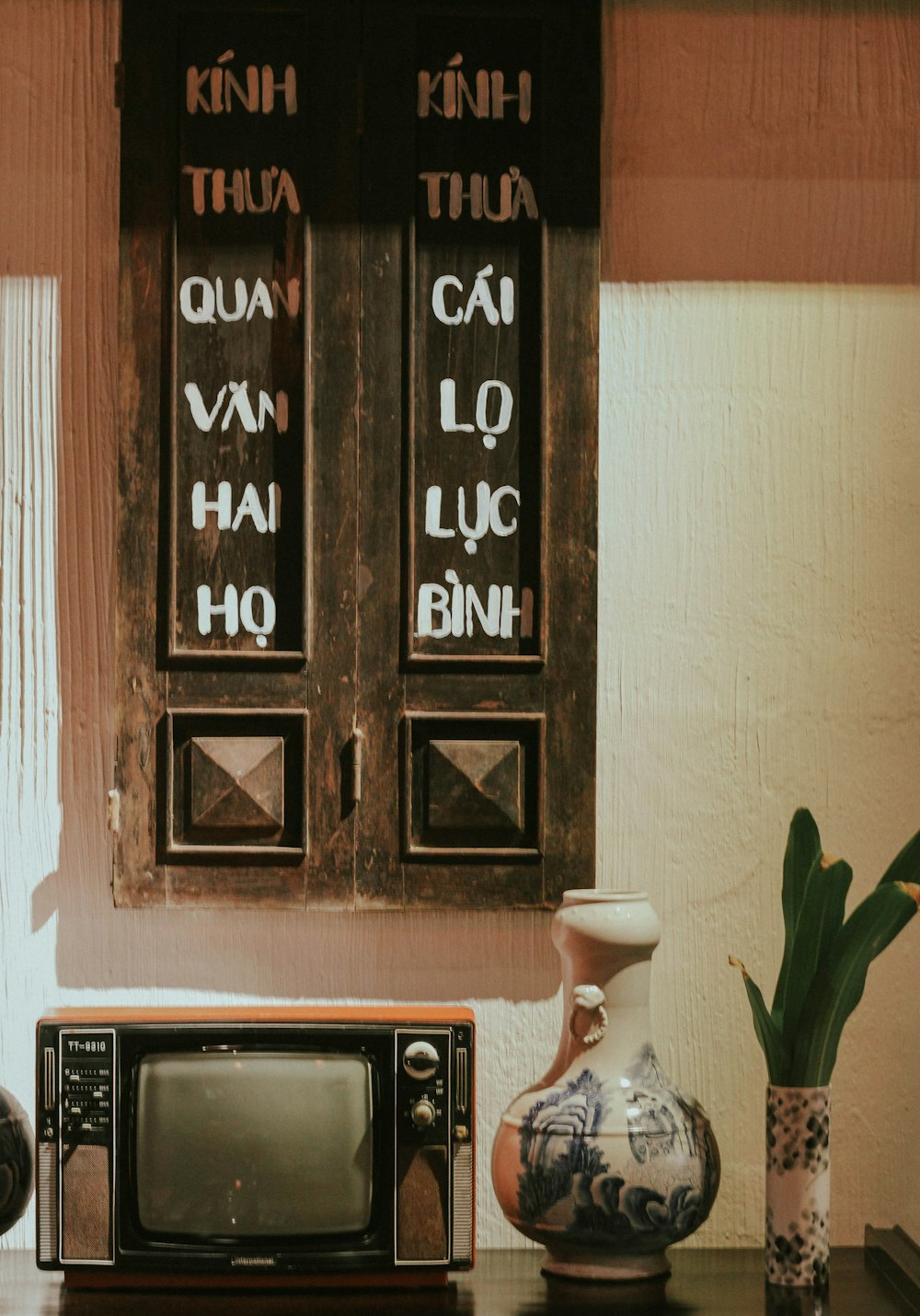 black and brown wooden wall mounted digital clock at 10 00