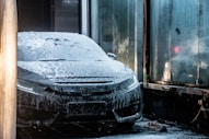 black car covered with snow