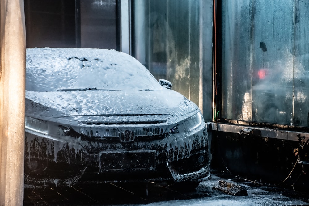 black car covered with snow