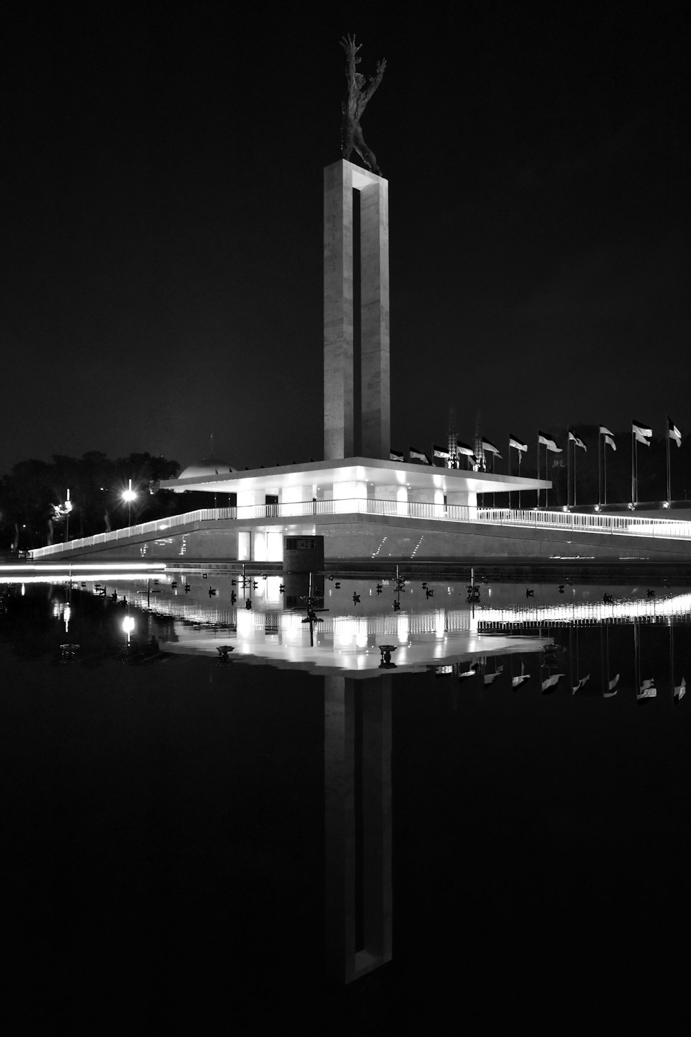 gray concrete bridge during night time
