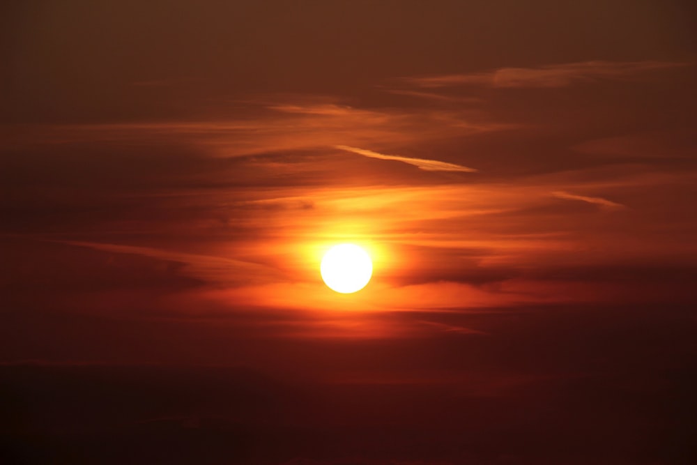 sun setting over the clouds