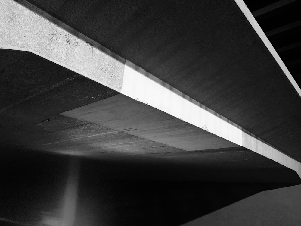 grayscale photo of a tunnel