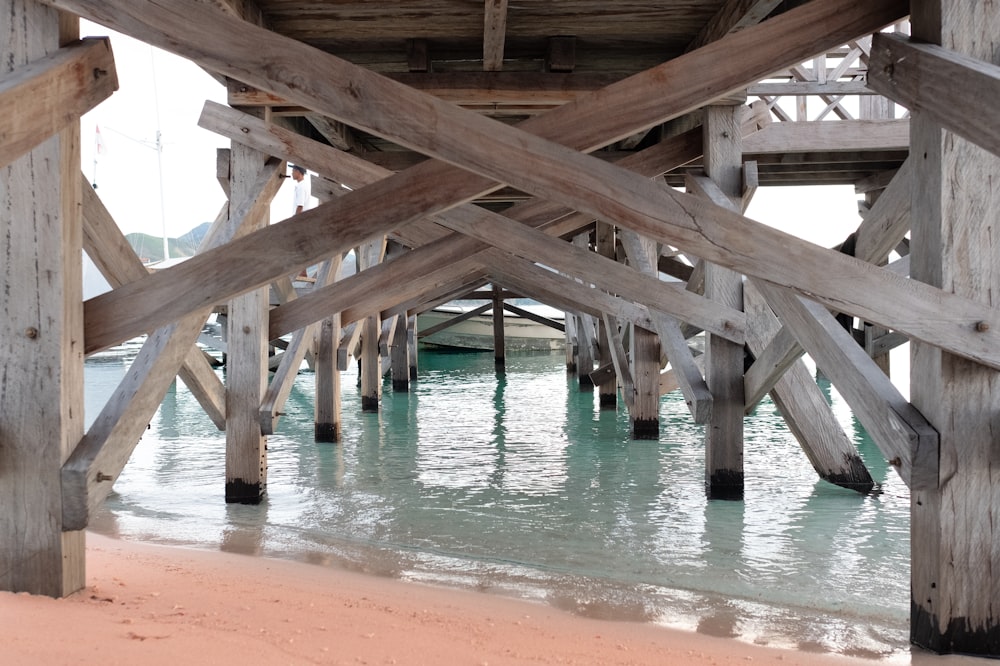 brown wooden dock over body of water during daytime