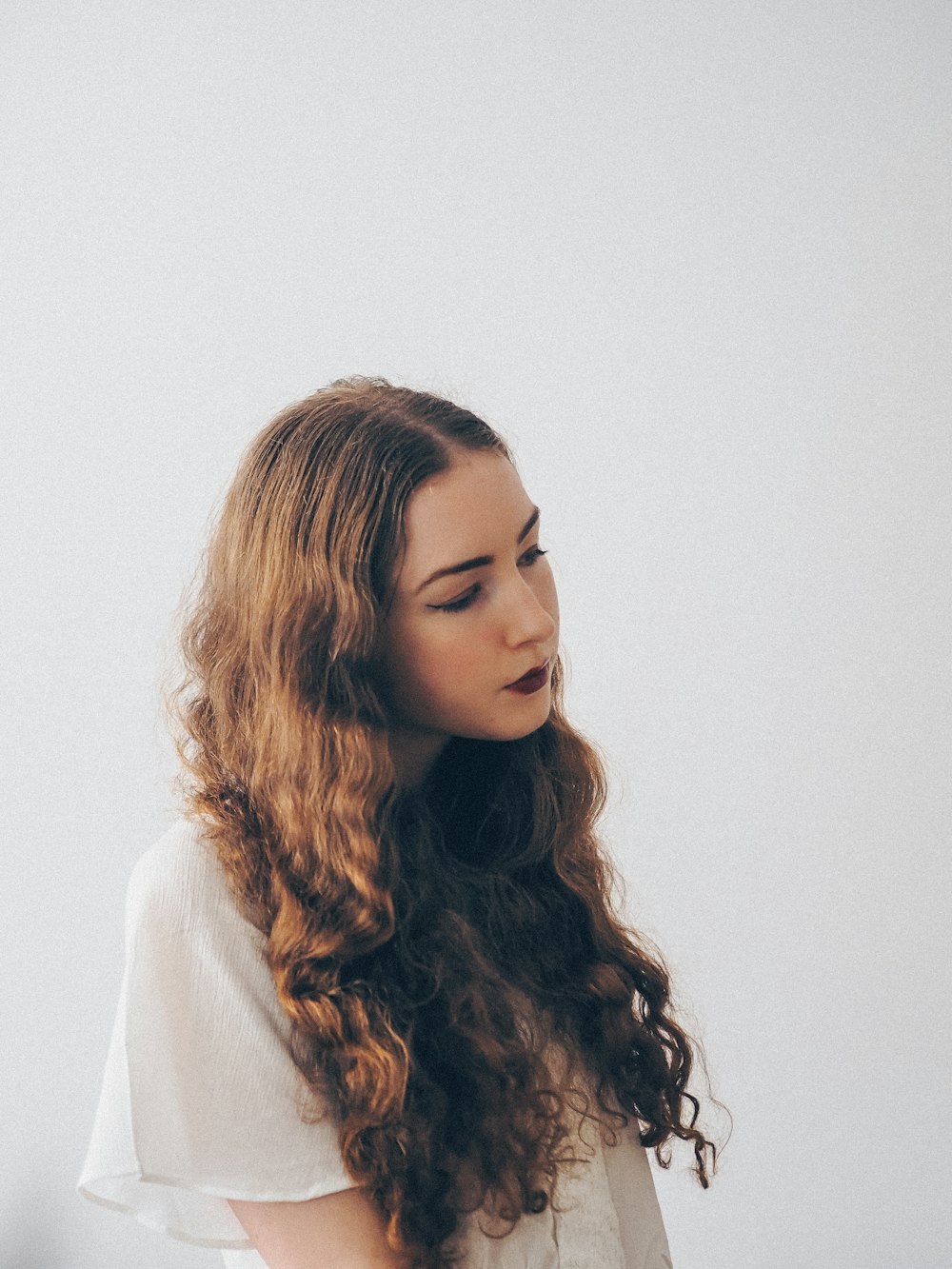 woman in white turtleneck sweater