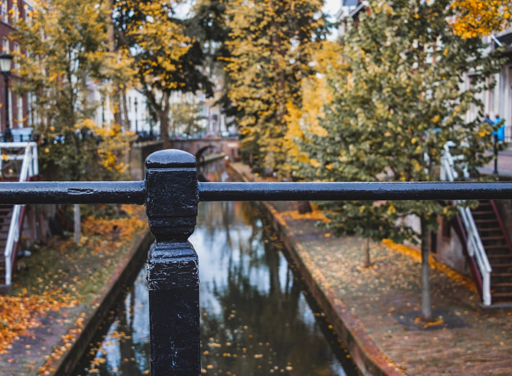 black metal railings near river during daytime