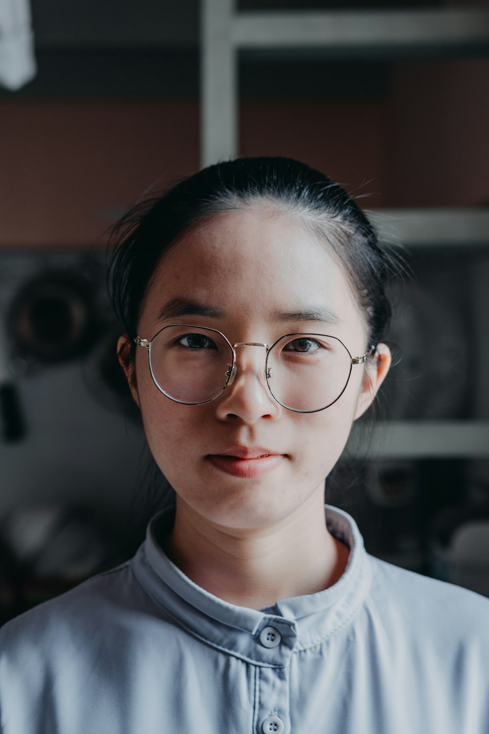 woman in white crew neck shirt wearing eyeglasses