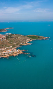 aerial view of city near body of water during daytime