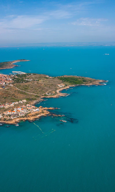 aerial view of city near body of water during daytime