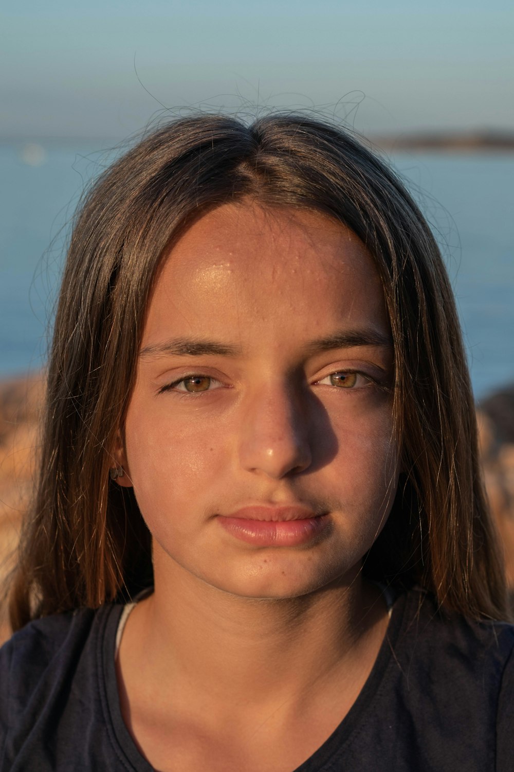 woman in black shirt with brown hair