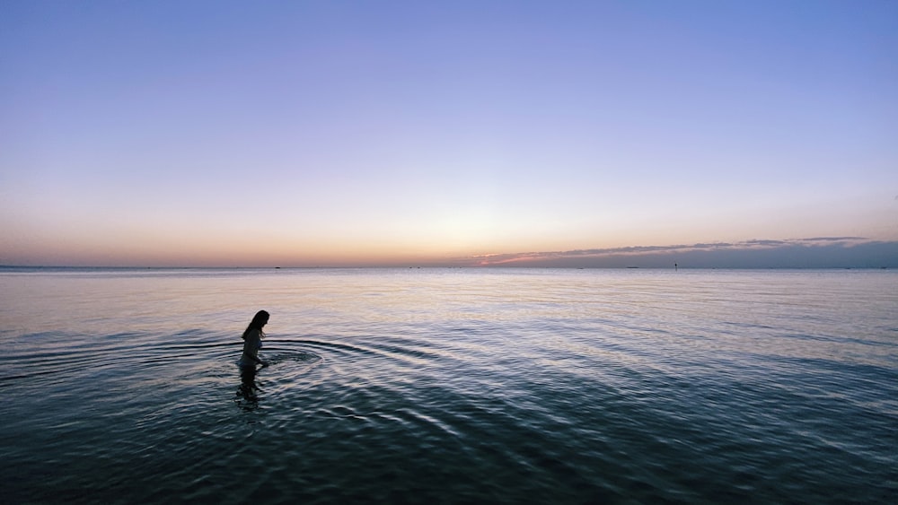 person in body of water during daytime