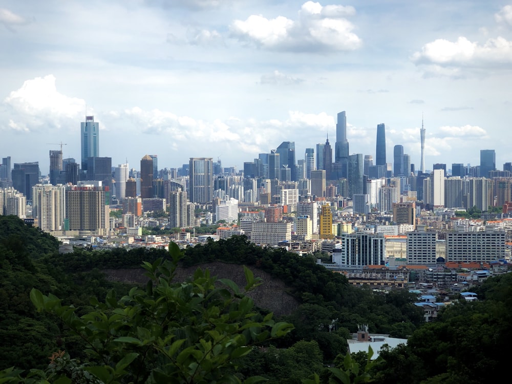 city skyline under white cloudy sky during daytime