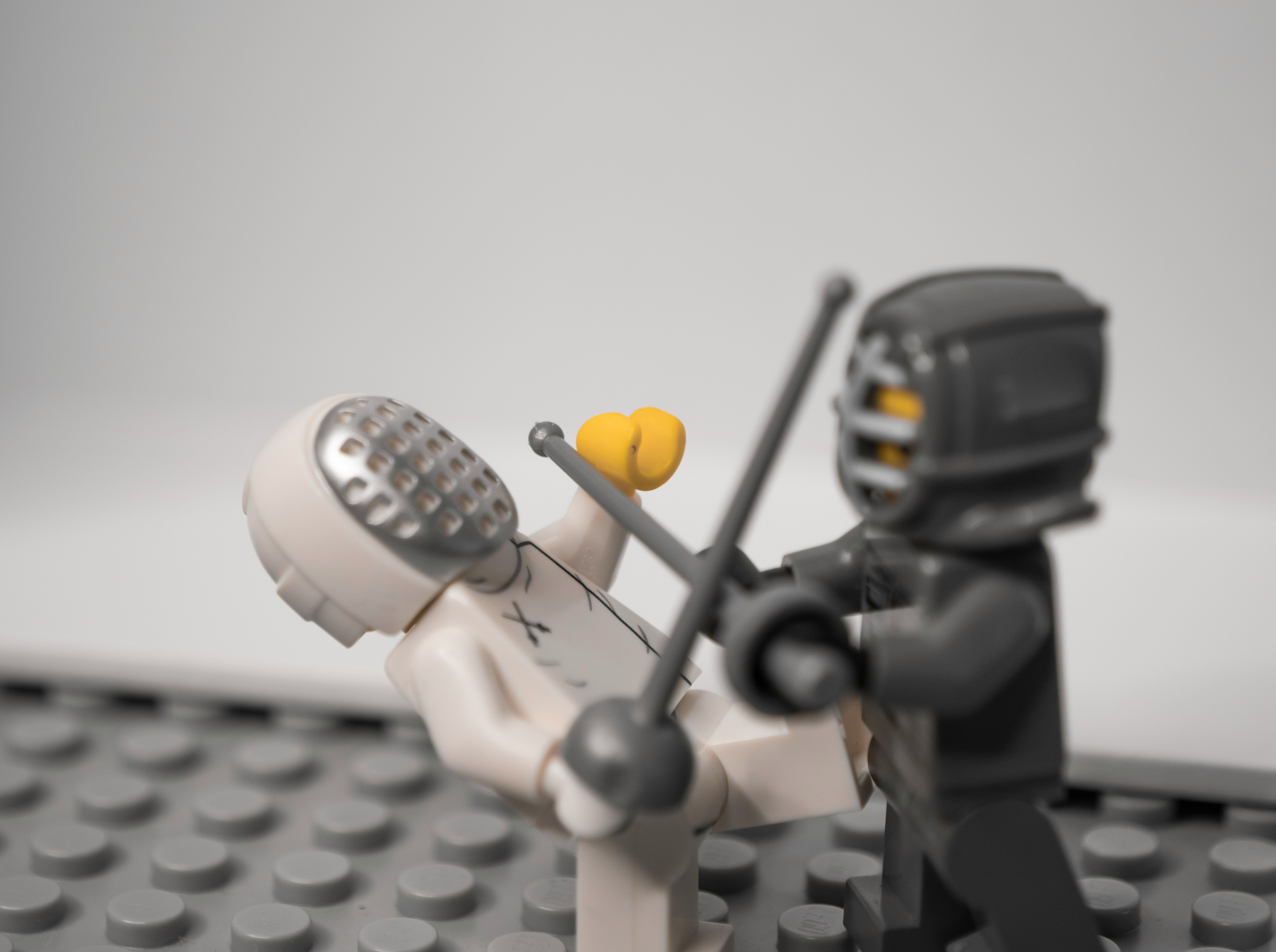 Fencer Lego figures fighting with swords