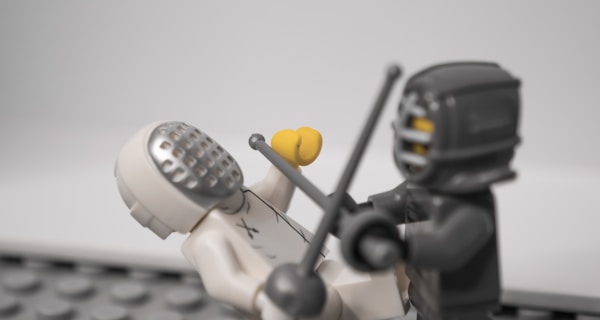 lego minifig holding black camera