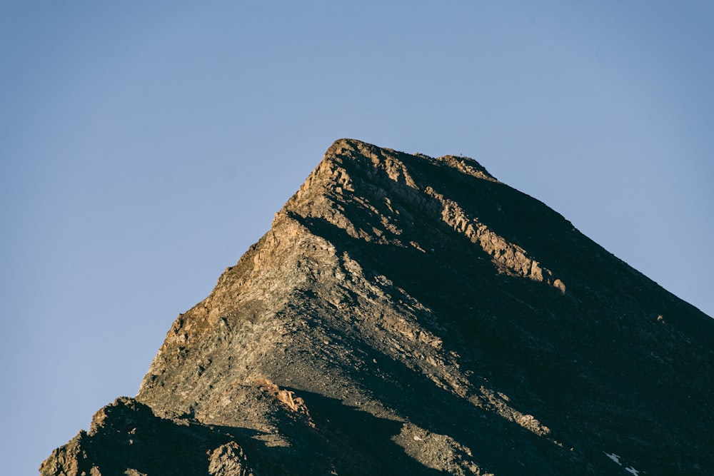 gray rocky mountain under blue sky during daytime