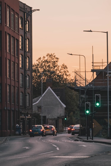 cars on road near building during daytime