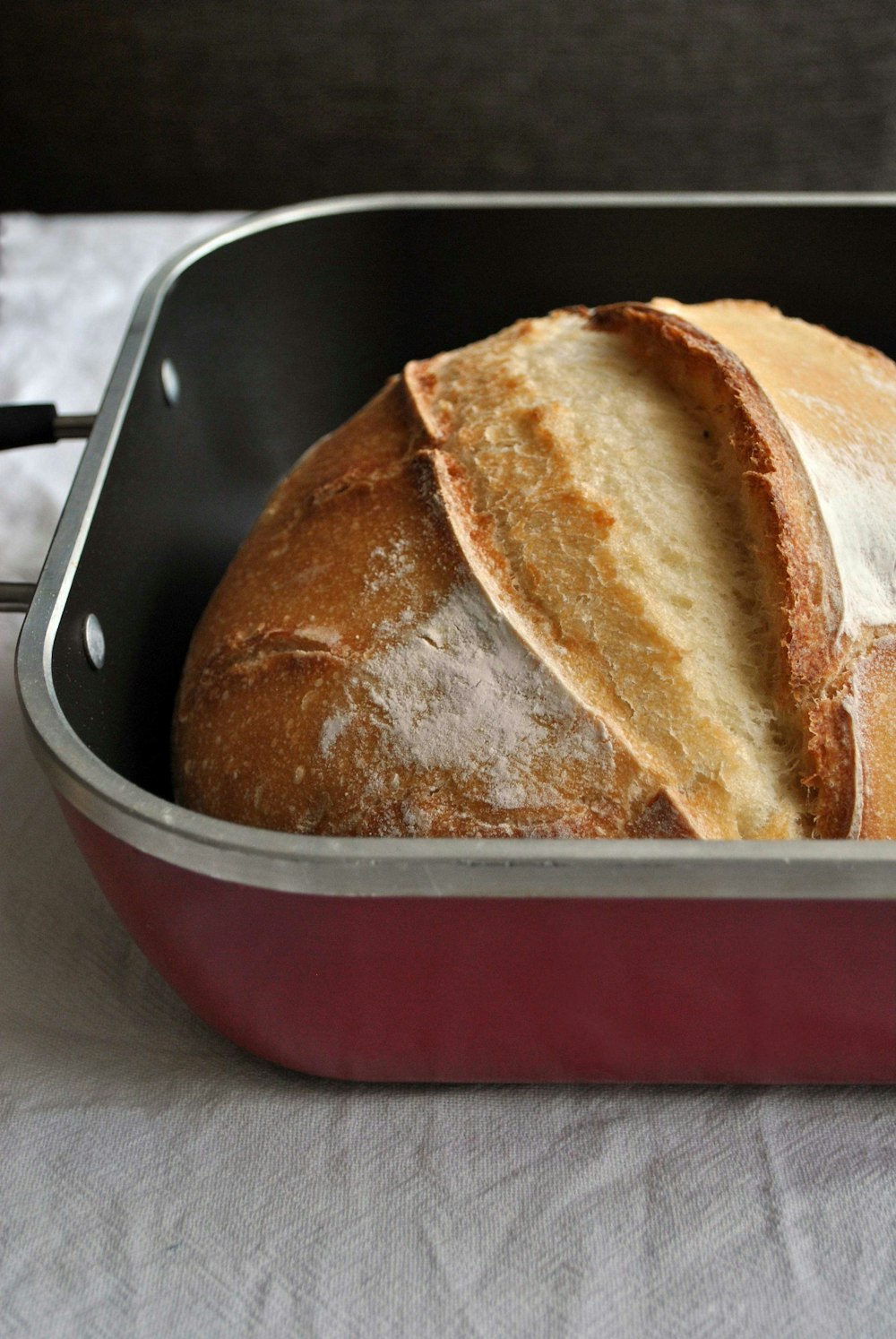 bread in red and black cooking pan